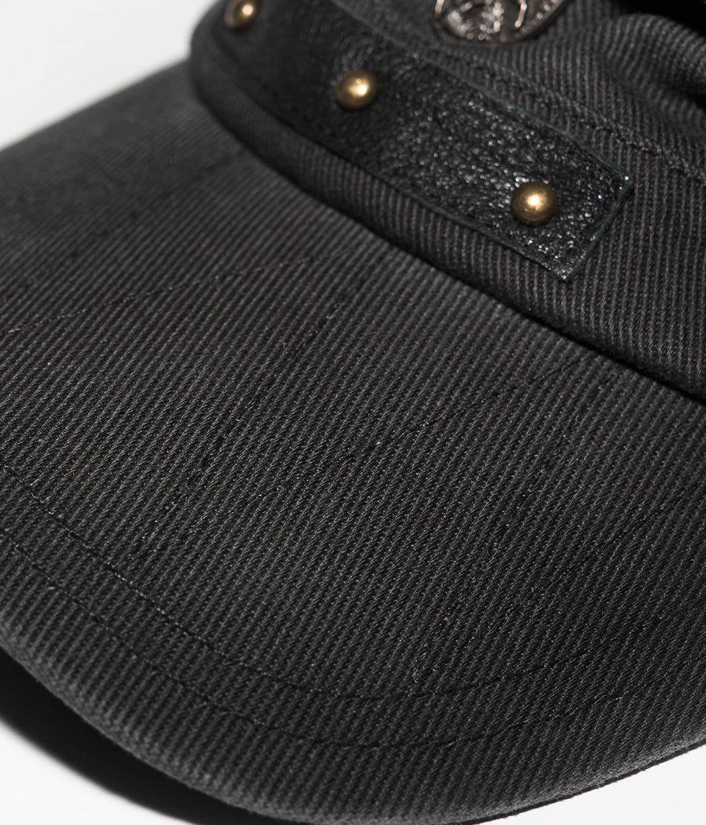 Black cap with gold buttons on a white background
