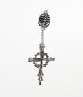 Silver cross earring with intricate design on a white background
